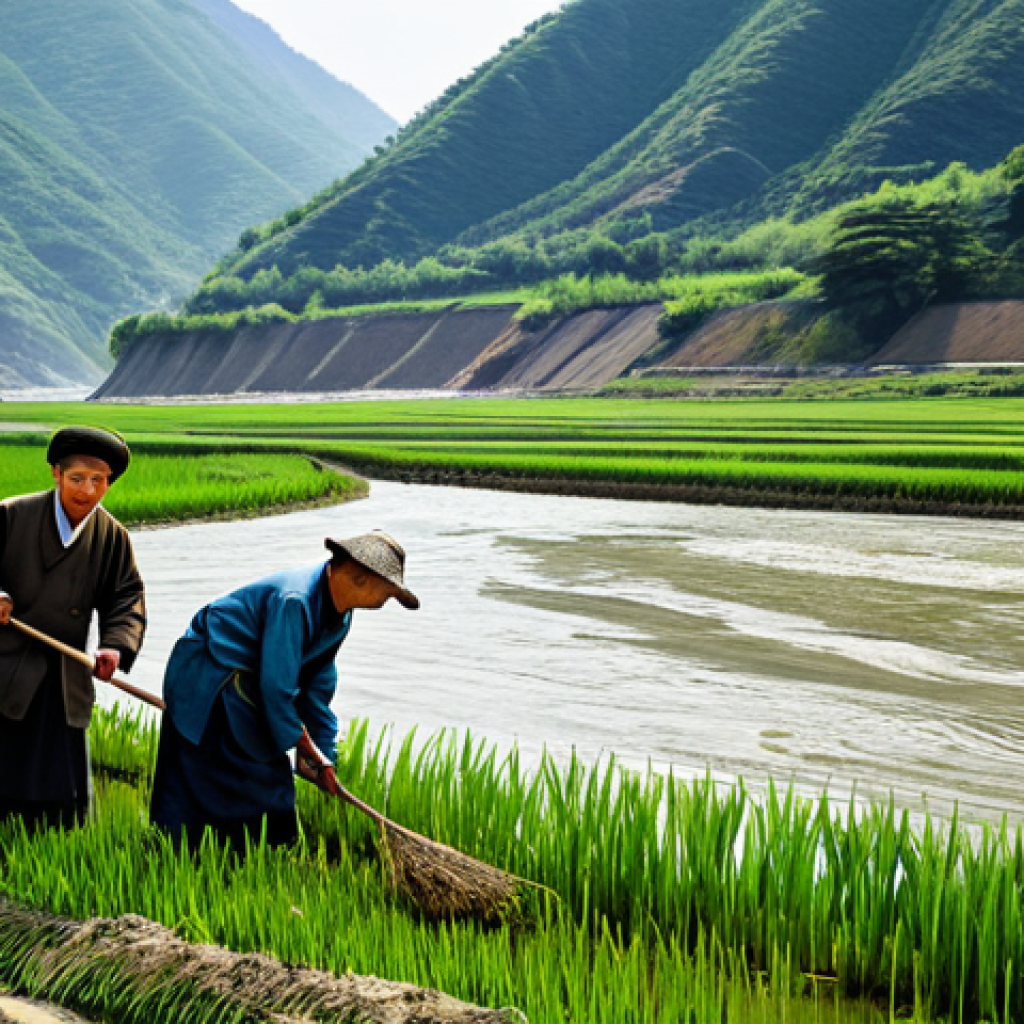 북한의 하천   수질 관리와 수자원 활용 - **

"A wide river flowing through a mountainous landscape in North Korea, fully clothed farmers tend...